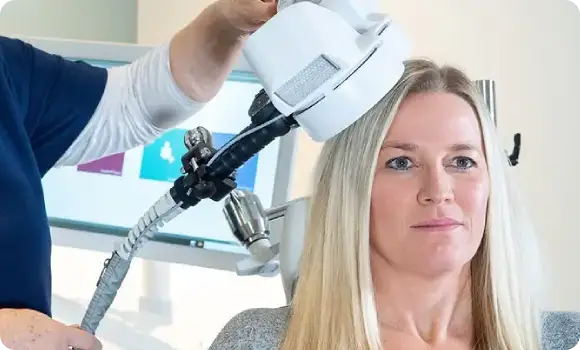 Transcranial Magnetic Stimulation magnetic coils being placed in preparation of depression treatment.